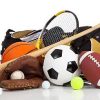 Assorted sports equipment on a white background with copy space